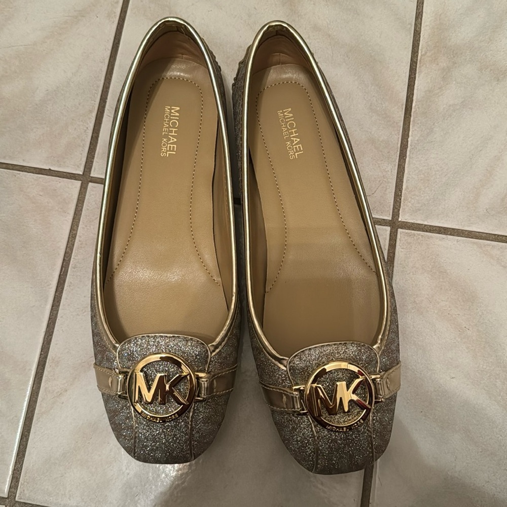 A pale gold Michael Kors Fulton MOC flats in size 7.5 M